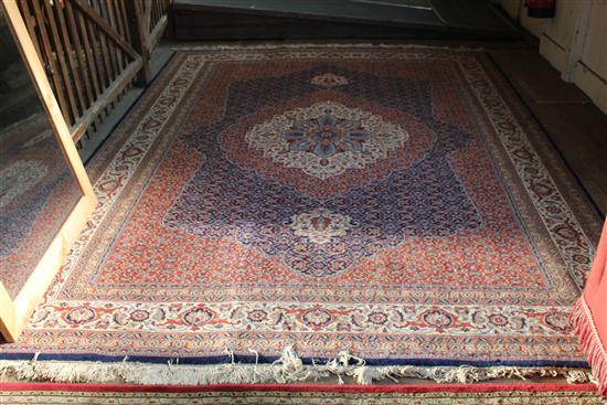 Persian design blue, red and ivory medallion carpet